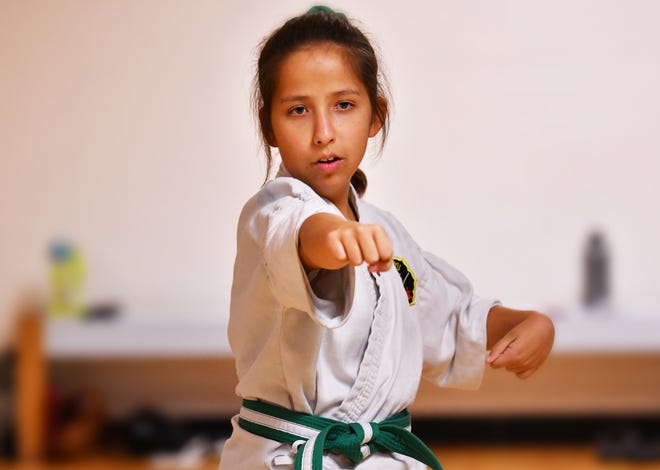 Holly Hammac, 12, recently earned her green belt at the Cocoa Beach Karate School in the traditional Matsubayashi-Ryu (Shorin-Ryu) style karate. The Roosevelt Elementary student was born with Polymicrogyria, secondary left-sided hemisphere cerebral palsy, epilepsy, autism and ADD. She is an inspiration to others students in the class.