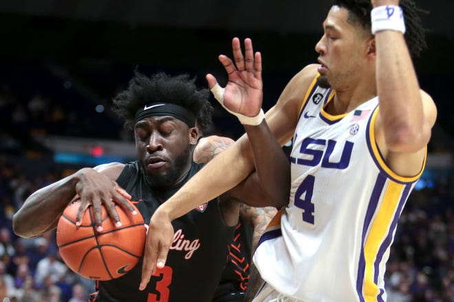 Bowling Green guard Caleb Fields (3) and LSU guard Skylar Mays (4) battle for the ball in the second half of an NCAA college basketball game in Baton Rouge, La., Friday, Nov. 8, 2019. (AP Photo/Brett Duke)