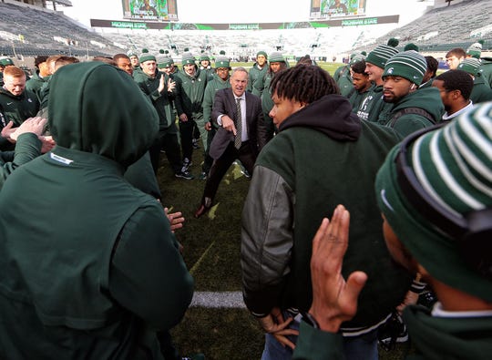 Nov 9, 2019; East Lansing, MI, USA; Michigan State Spartans head coach Mark Dantonio talks to his team in the end zone prior to a game against the Illinois Fighting Illini at Spartan Stadium. Mandatory Credit: Mike Carter-USA TODAY Sports