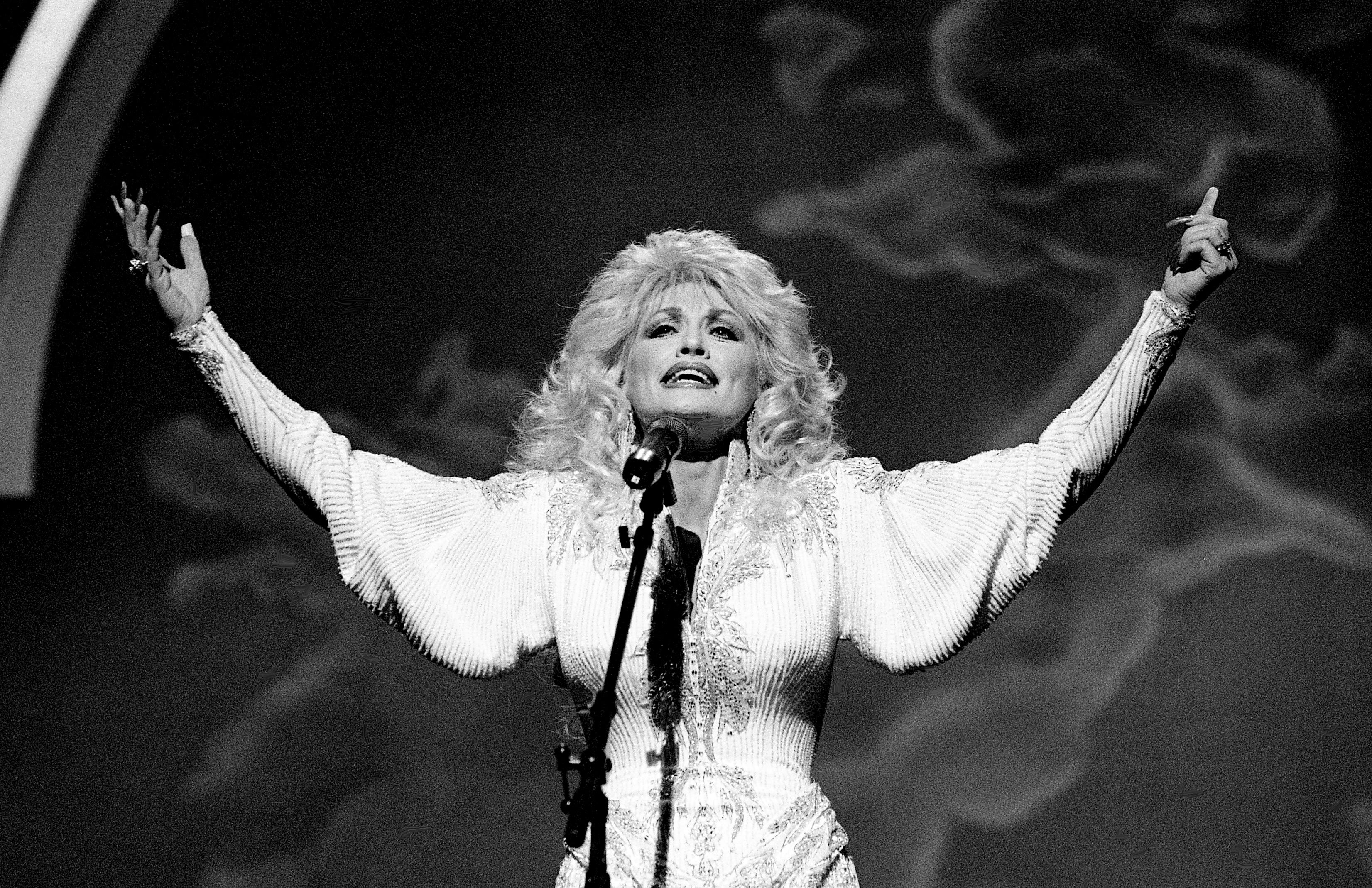 Dolly Parton sings the inspirational "He's Alive" backed by a full gospel choir during the 23rd annual CMA Awards show at the Grand Ole Opry House Oct. 9, 1989.