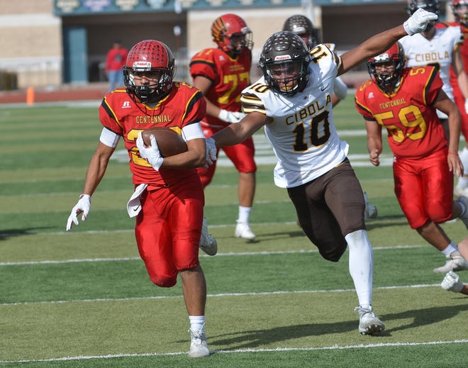 Gabriel Acosta breaks away for a Centennial touchdown on Saturday afternoon as the Hawks took on the Cibola Cougars in the first round of the state football playoffs at Field of Dreams.