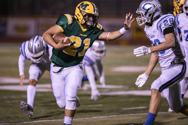 The Mayfield Trojans defeated the Carlsbad Cavemen to advance to the quarterfinals of the 6A state football tournament.