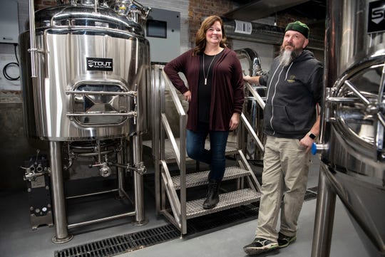 Handmap Brewing owners Jennifer Brown and Chris McCleary pose for a portrait on Monday, Nov. 11, 2019, located at 15 Carlyle St. inside the Record Box building in Battle Creek, Mich.