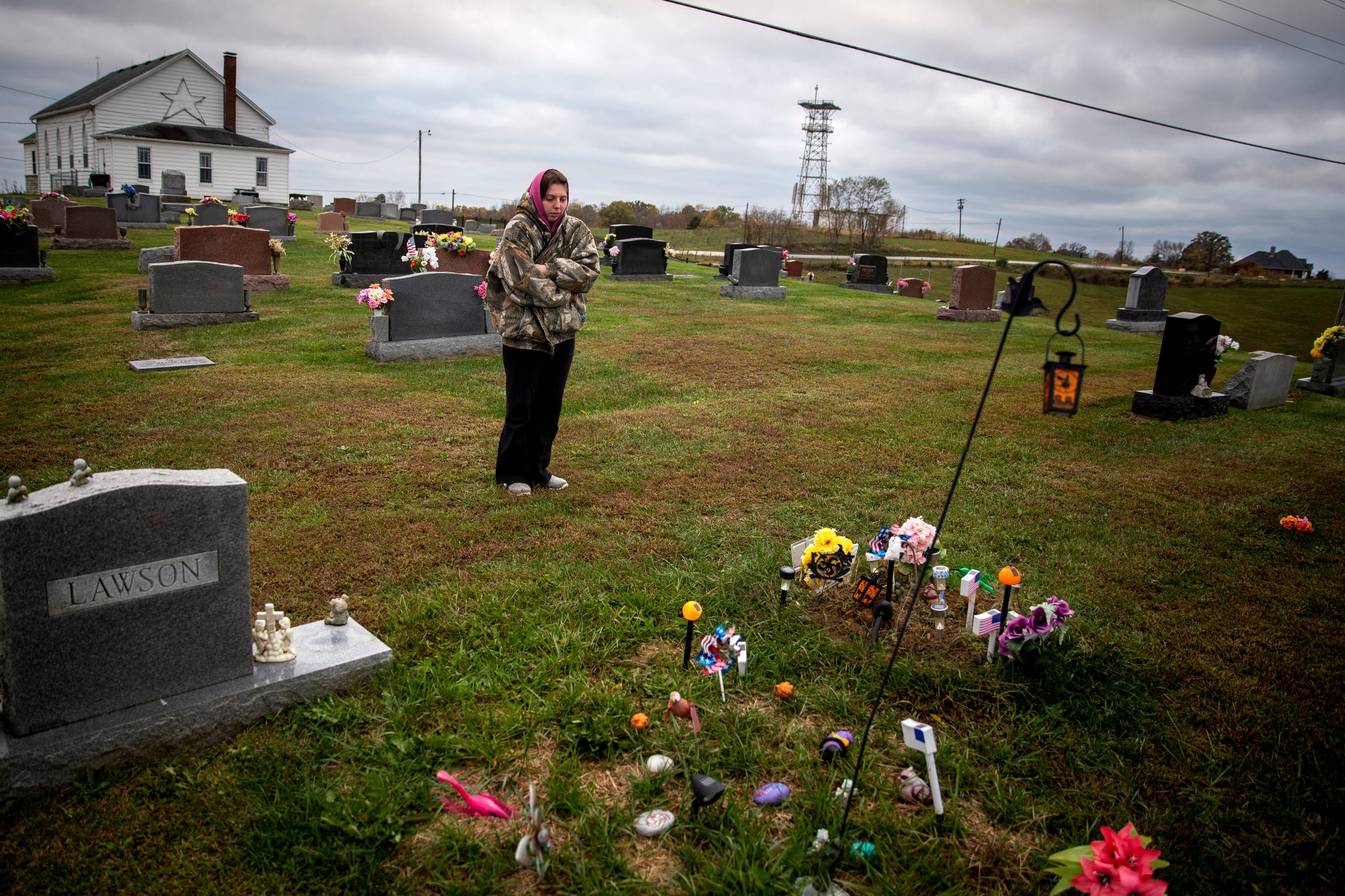 Tabitha Bates, 25, stands near her infant son Owen's gravesite at Mount Moriah Cemetery in Pendleton County. Owen died May 12 in Cincinnati Children's Hospital Medical Center, just 10 days after a difficult, premature birth.