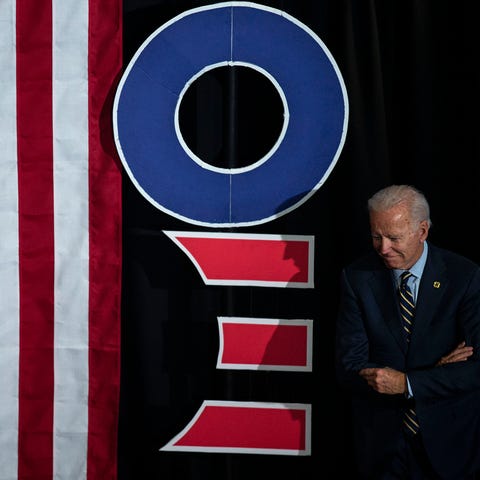 Former Vice President Joe Biden enters his town ha
