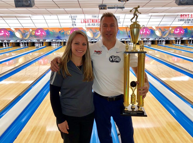 Kristen Gessner of Hanover Bowling Centre presents the York County Masters championship trophy to Richie Wolfe.