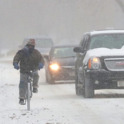 William Immekus,  of Fox Point, rides his bike to 