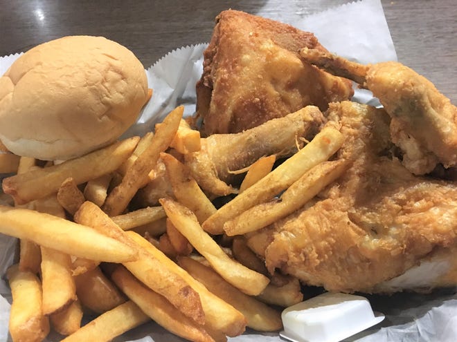 Curly's Bar & Restaurant in Colon is known for its broasted chicken, which you can order in quantities of two pieces or 100.