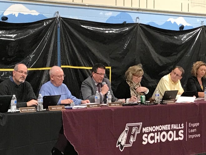 Menomonee Falls School District superintendent Corey Golla (middle, with microphone) discusses the Menomonee Falls mascot at a school board meeting in November 2019. Golla has left the district, along with a host of other top administrators.