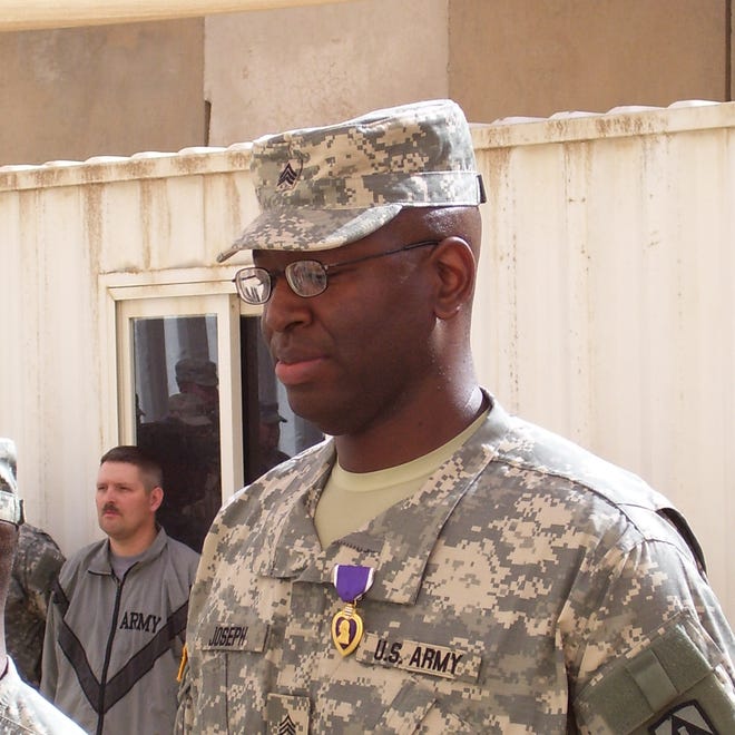 Staff Sergeant Louis Joseph receiving the Purple Heart Award