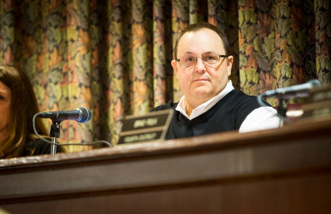 City Council President Doug Marshall looks over the crowd at the start of the November council meeting.