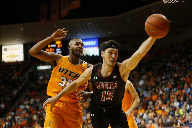 UTEP's Efe Odigie goes against New Mexico State University's Ivan Aurrecoechea during the game Tuesday, Nov. 12, at the Don Haskins Center in El Paso.