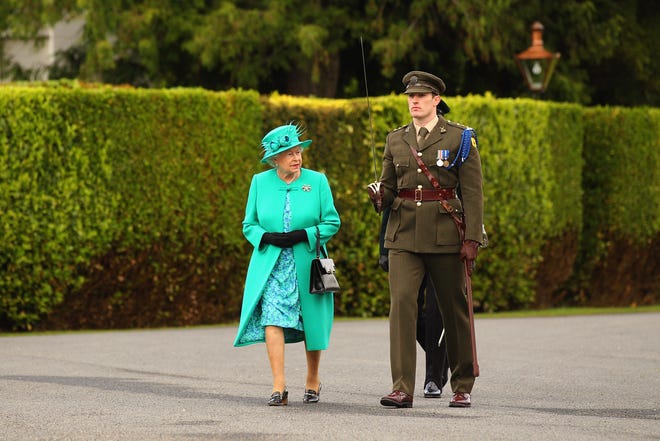 Queen Elizabeth II inspects the guard of honor at the Aras an Uachtarain, the official residence of the President of Ireland, on May 17, 2011 in Dublin.