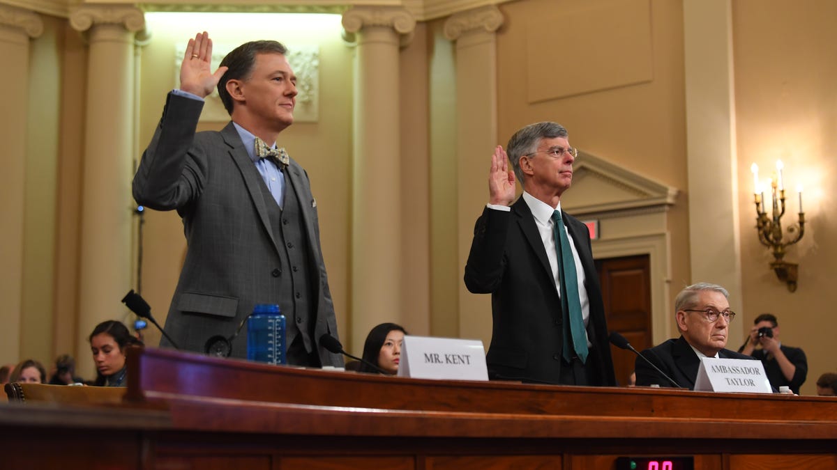 State Department Ukraine-Russia expert George Kent, left, and William B. Taylor, Jr., the top American diplomat in Ukraine are sworn in ahead of testifying before the Permanent Select Committee on Intelligence as the first witnesses in public congressional hearings in the impeachment inquiry into allegations President Donald Trump pressured Ukraine to investigate his political rivals on Nov. 13, 2019.