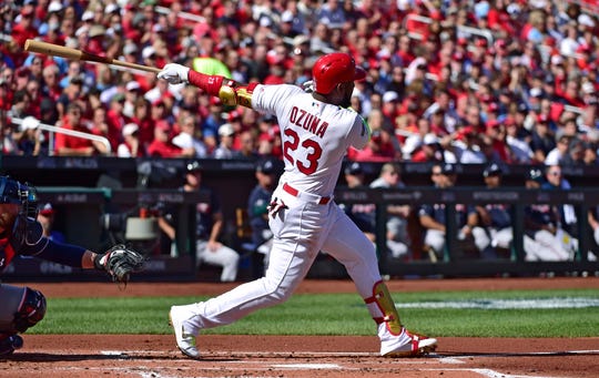 Oct 7, 2019; St. Louis, MO, USA; St. Louis Cardinals left fielder Marcell Ozuna (23) hits a solo home run against the Atlanta Braves in the first inning in game four of the 2019 NLDS playoff baseball series at Busch Stadium. Mandatory Credit: Jeff Curry-USA TODAY Sports