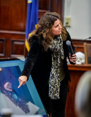 Dr. Nikki Mourtzinos, a medical examiner, describes the findings from a 2016 autopsy she conducted on the body of Adam Petzack during testimony Thursday morning at the Cascade County Courthouse.  Brandon Craft is on trial, charged with deliberate homicide, for the 2016 shooting death of Adam Petzack, which occurred at a private residence just outside of Great Falls in Cascade County.