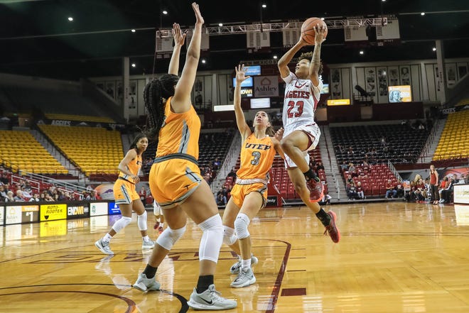 Junior guard Aaliyah Prince (23) shoots as the NMSU Aggies face off against the UTEP Miners at the Pan American Center in Las Cruces on Wednesday, Nov. 13, 2019.