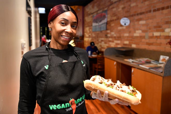 Sharonda Harris-Bunton, owner of Vegans Are Us in Vineland, holds a Philly V-Steak.