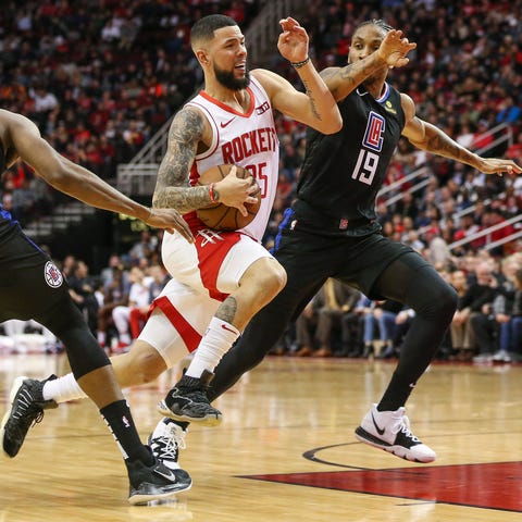 Houston Rockets guard Austin Rivers drives against