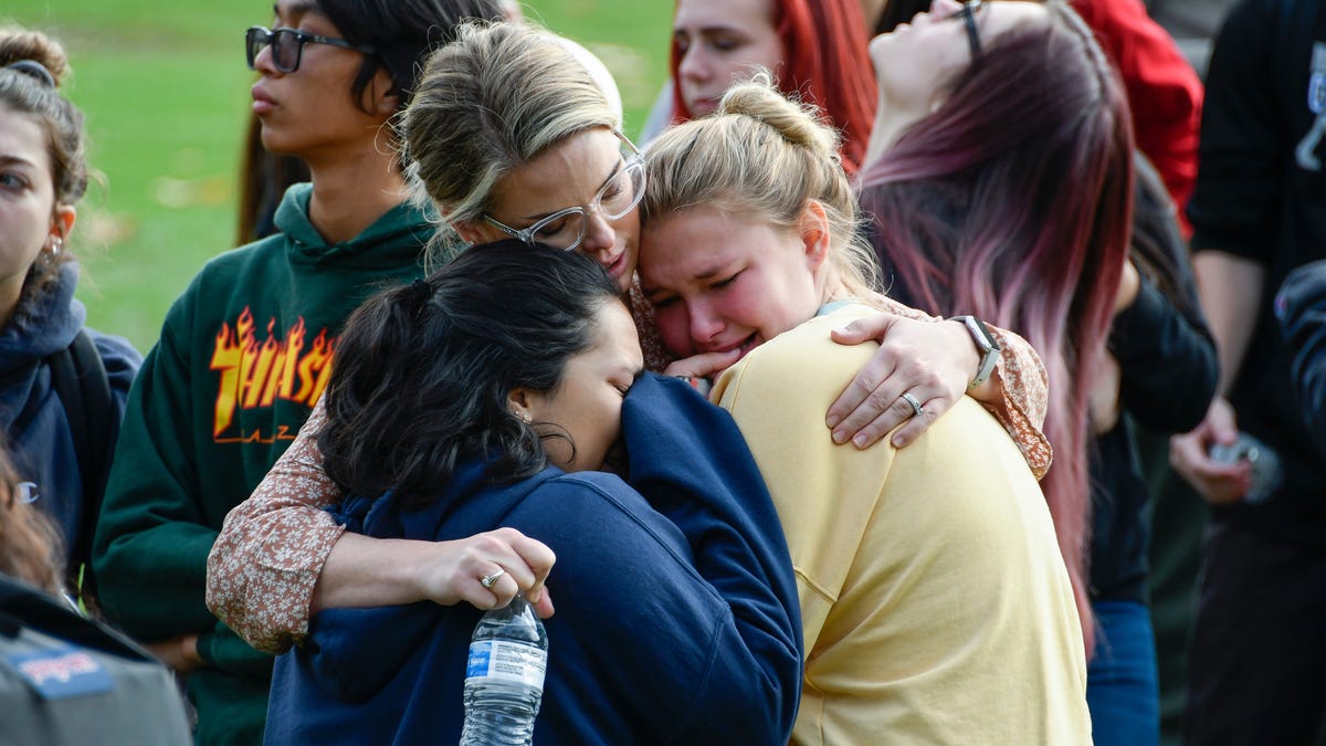 Saugus High students hug as they wait to be picked up by family members at a reunification point after a shooting at Saugus high school in Santa Clarita, Calif. on Nov 14. 2019.  