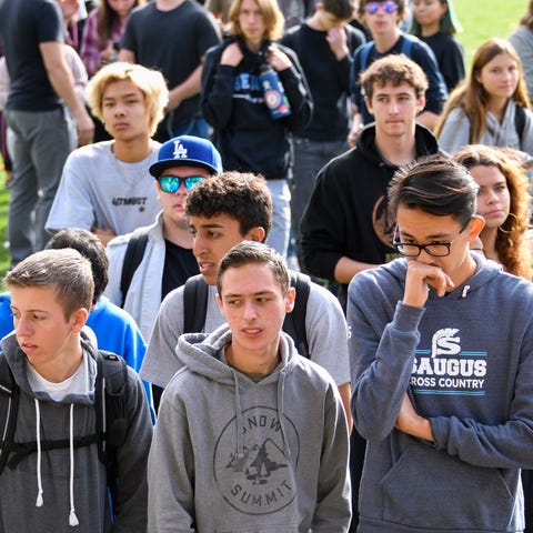 Saugus High students wait to be picked up by famil