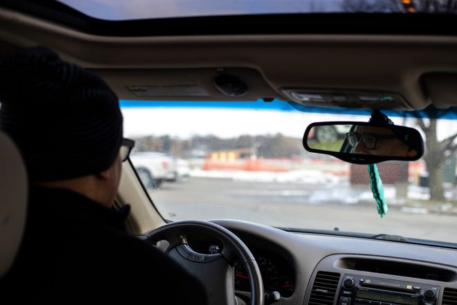 John Posey, a housing case manager at Shelter House, drives to meet with a property manager, Thursday, Nov., 14, 2019, in Iowa City, Iowa.