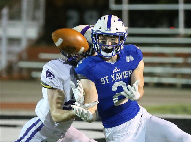 St. Xavier wide receiver Liam Clifford (2) catches a pass during the Bombers' 28-24 loss to Elder, Friday, Nov. 15, 2019.