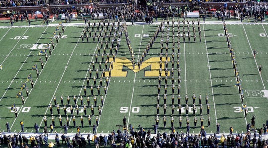 The Michigan marching band takes the field before the game against Michigan State on Saturday, Nov. 16, 2019, at Michigan Stadium.