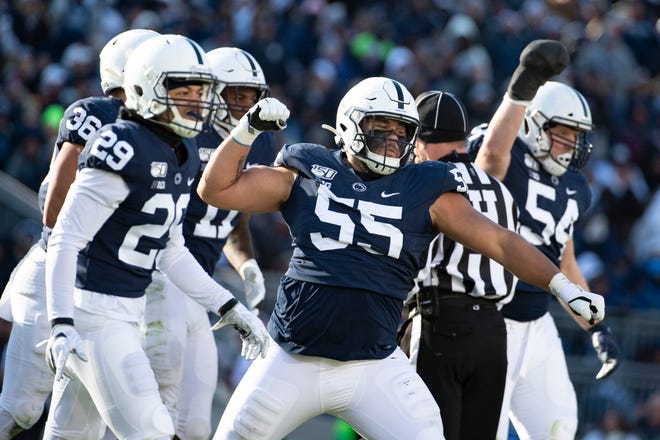 Penn State defensive tackle Antonio Shelton (55) celebrates after stopping Indiana tight end Peyton Hendershot (86) on a fake punt in the third quarter on Saturday.