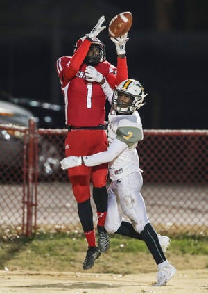 Manual wide receiver Eli Blakey tried to stay in bounds for the end zone catch but was pushed out by St. X's Anthony Woods in the second round of the 6A playoffs. Nov. 15, 2019