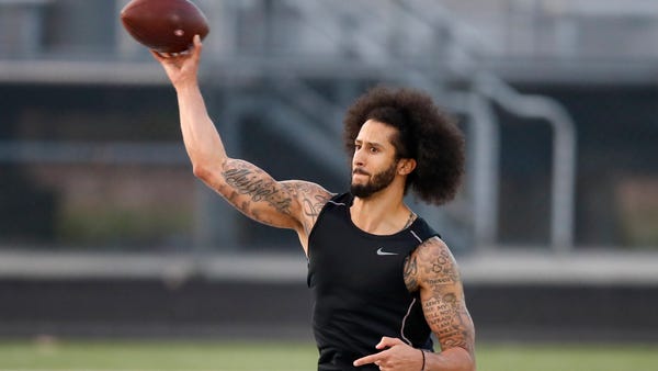 Free agent Colin Kaepernick participates in a work