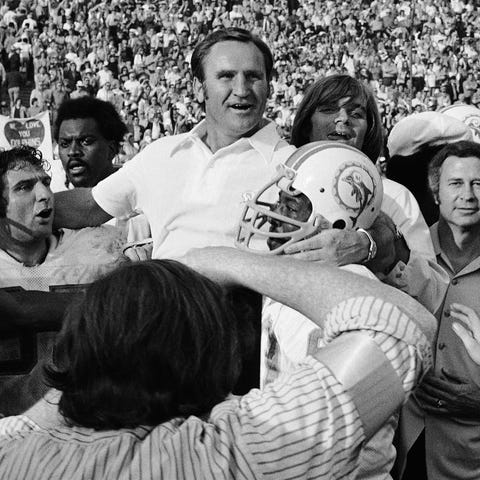 Miami Dolphins coach Don Shula is carried off the 