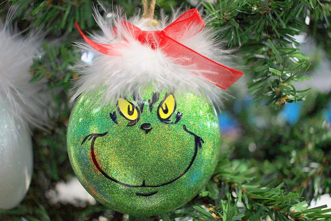 A Grinch Christmas ornament adorns a tree at the Christmas Harvest Craft Show in Gallatin, Tenn. on Saturday, November 16, 2019.