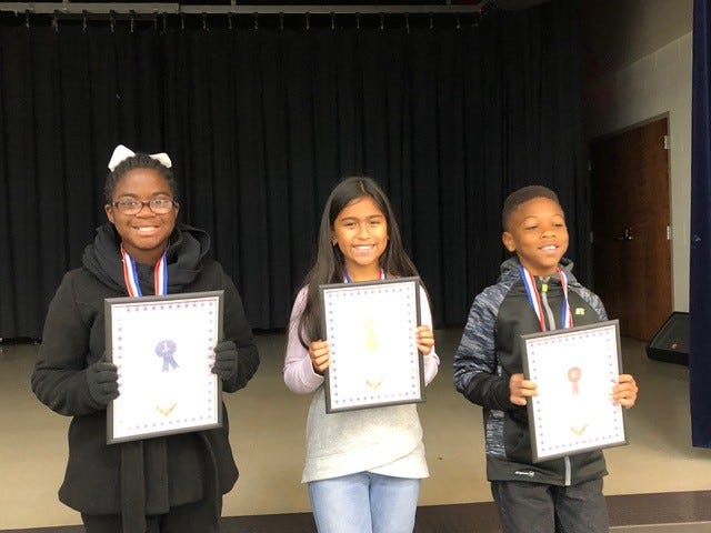 Conley Elementary's top three Veterans Day essayists, pictured left to right: Erin Howard, Maelai Chavez and Corey Allen.