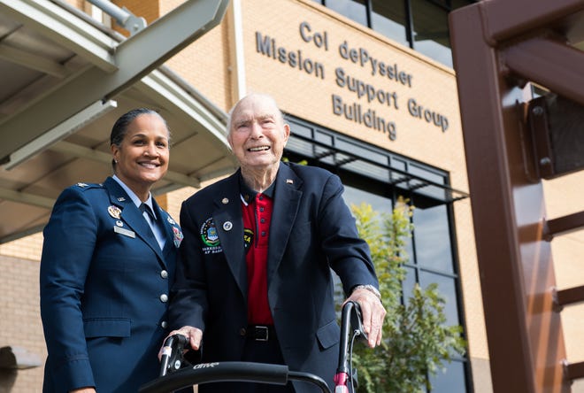 Retired Col. Steven L. dePyssler (right), director of military retiree affairs for Barksdale, poses for a photo with Col. Sara Ann Custer (left), 2nd Mission Support Group commander, following a building dedication ceremony at Barksdale Air Force Base, La., Nov. 8, 2019. The renaming of the newly established dePyssler Mission Support Group building was announced back in July 2019 after dePyssler celebrated his 100th birthday.