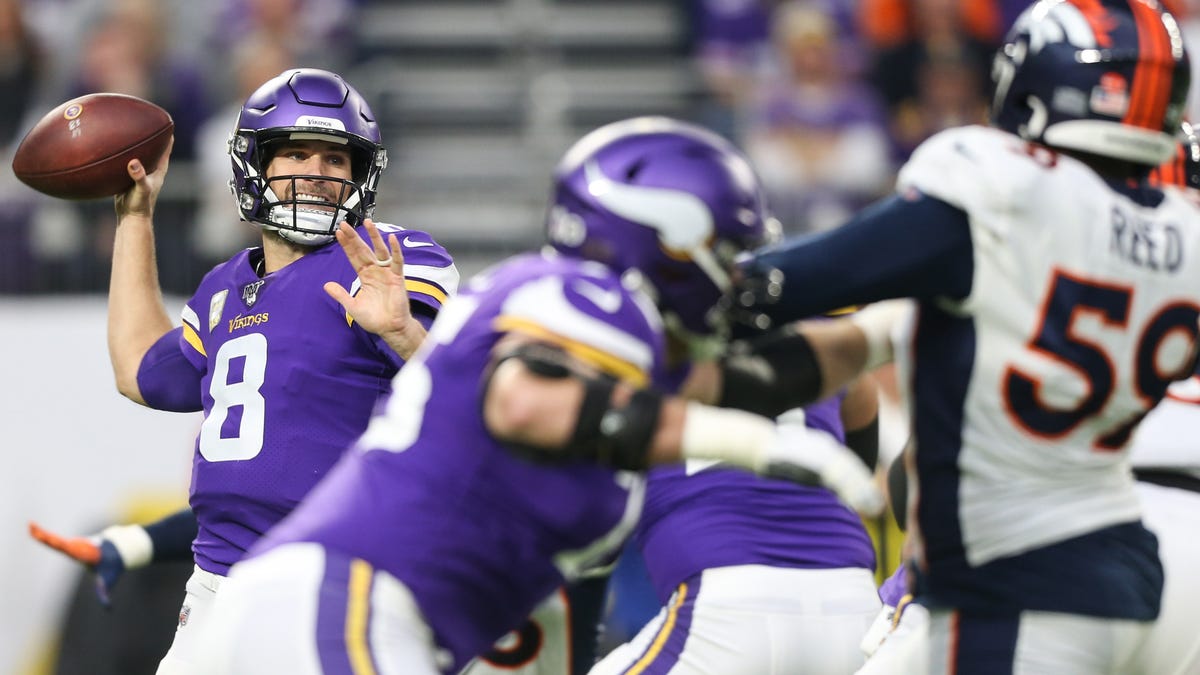 Vikings quarterback Kirk Cousins throws a pass against the Broncos.