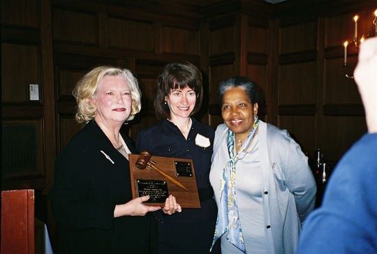 In this 2006 file photo, Attorney Ruby Wharton (right) and Judge Kay Spalding Robilio (left) present Barbara Zoccola with the Marion Griffin-Frances Loring award at the Association of Women Attorneys annual banquet at the University Club.