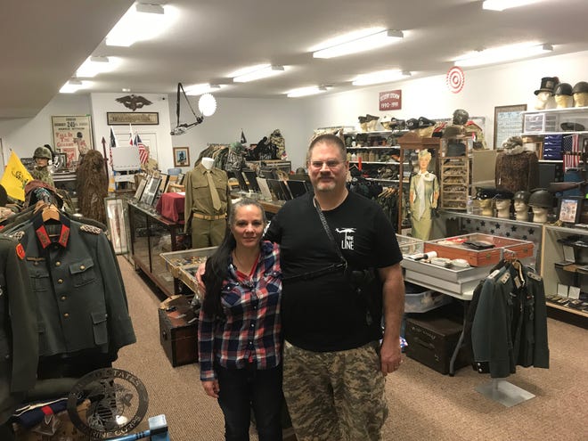 Owners of Military Connection in South Milwaukee (from left) Jeannie Luther and Craig Luther inside their shop. The shop carries military items from various eras and countries.