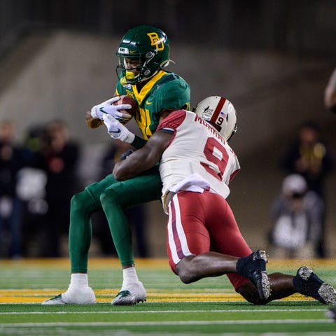 Baylor wide receiver Tyquan Thornton is tackled by