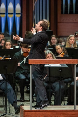 Radu Paponiu conducting the annual concert that pairs Philharmonic musicians with top students