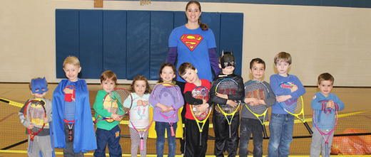 Youth Fitness Director, Holly Metzger-Brown and her kids at the York JCC line up for a photo before their tennis class.