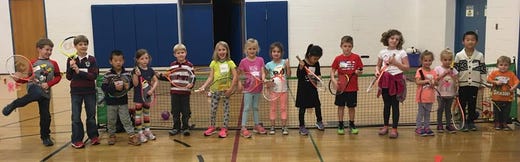 Kids at the York JCC line up for a photo before their tennis class.