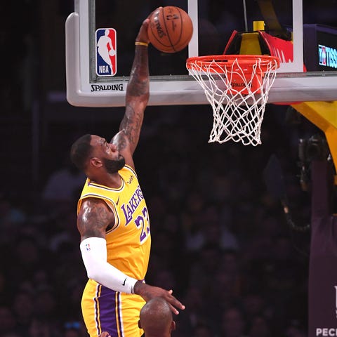LeBron James dunks in the first half of the Lakers