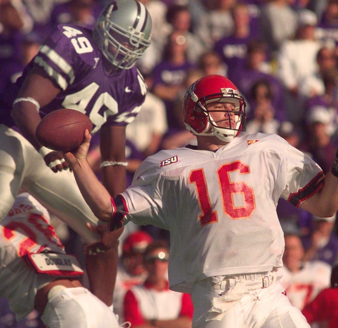 Former Kansas State defensive end Darren Howard (49) pressures Iowa State quarterback Todd Bandhauer during a 1998 game in Manhattan. Howard was inducted into K-State's Ring of Honor on Saturday at Bill Snyder Family Stadium.