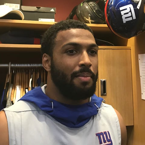 NY Giants rookie Julian Love talks to reporters at