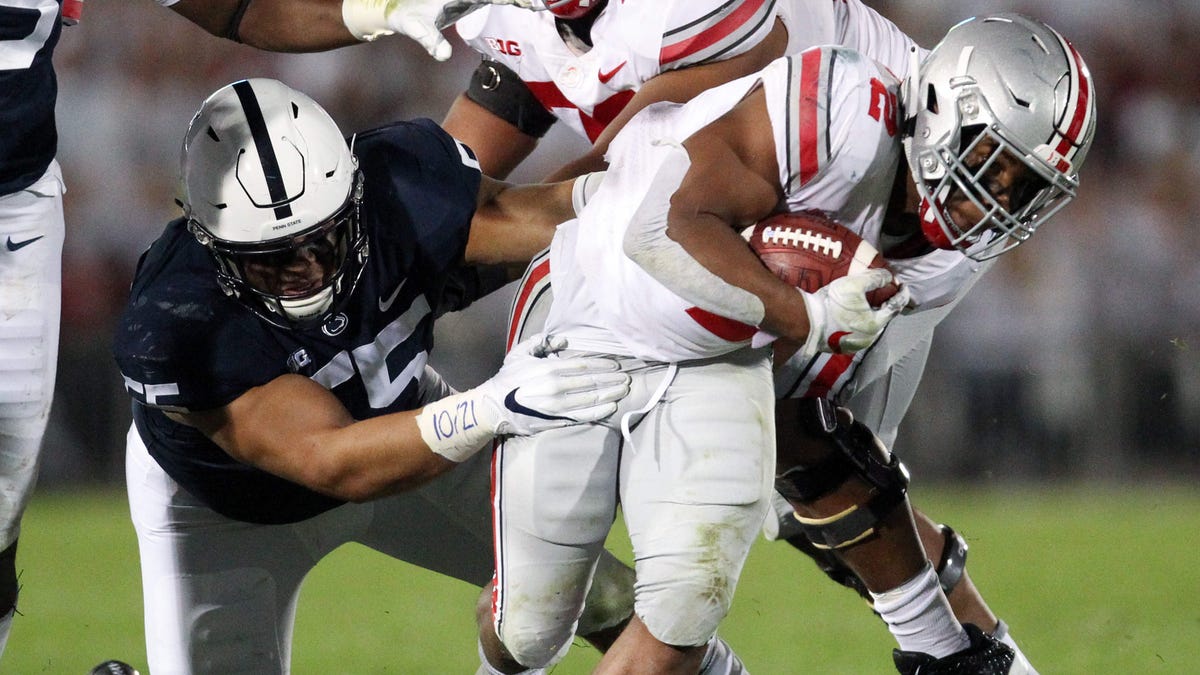 Ohio State running back J.K. Dobbins carries the ball against Penn State during their 2018 game at Beaver Stadium.
