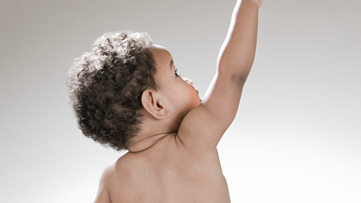Baby in diaper stock image.