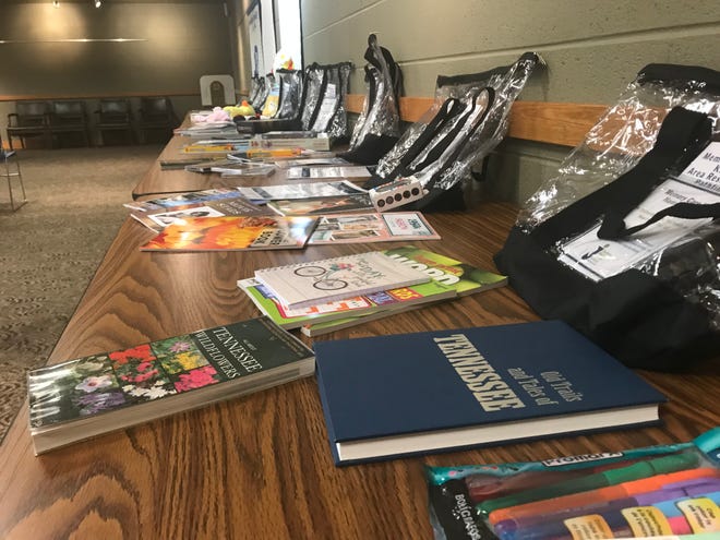 Memory care kits line a table at the library during the presentation on Thursday in which they were unveiled so they can be checked out for anyone who needs them temporarily.