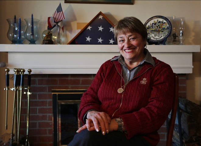Supporter of President Trump and former head of the Somers Republican Party is Rosalie Cicogna, in the living room of her home by a flag that flew over the capitol in Washington DC and covered her father’s casket who had served in World War II. The town of Somers survives as one of only two Republican districts in Westchester County, NY. 