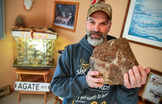 Lyndon Johnson holds one of his larger agates of more than 30 pounds Friday, Nov. 22, 2019, at his home in Sauk Rapids. Johnson has been finding, collecting and sharing his knowledge on locate agates and rare minerals for decades. 